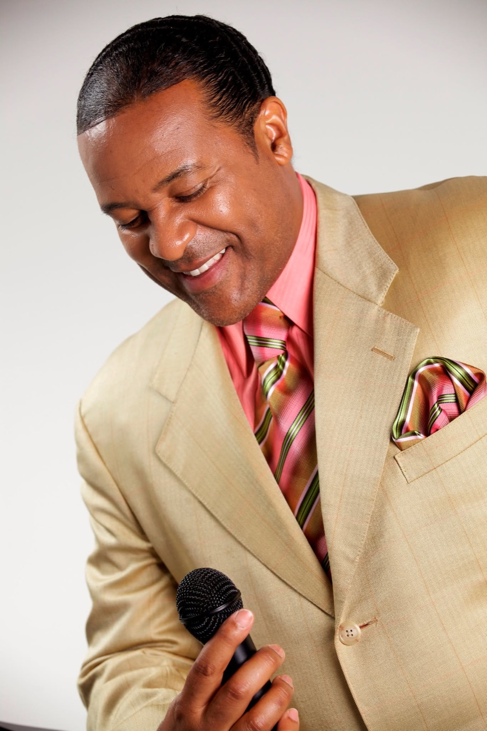 Kevin T. Robertson holding a microphone