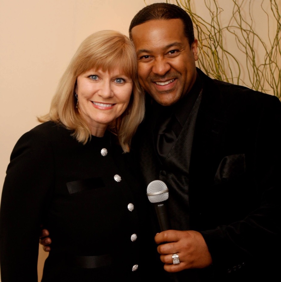 Kevin T. Robertson with an event professional after a program