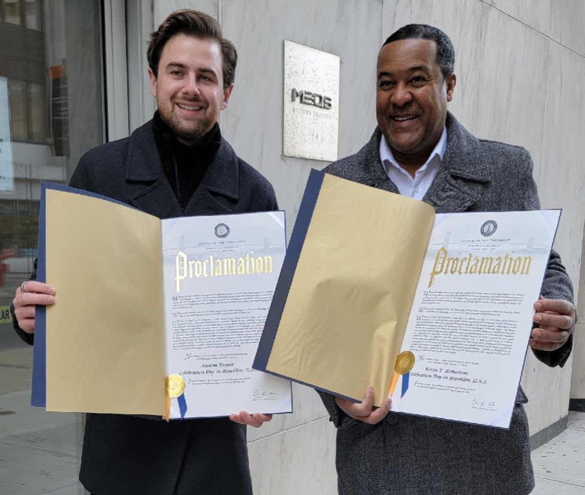 Kevin T. Robertson and Auston Troyer holding SpeakerFocus proclamation awards